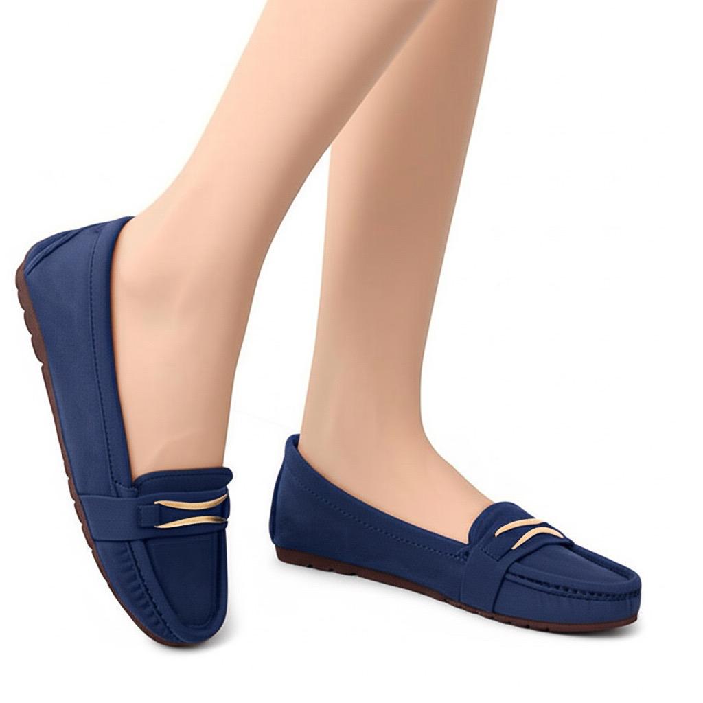 Navy blue loafers worn by a person on a white background