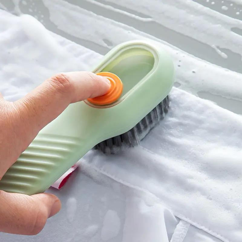 Shoe cleaning brush with liquid wash bottle