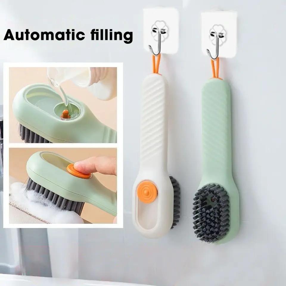 Shoe cleaning brush with liquid wash bottle